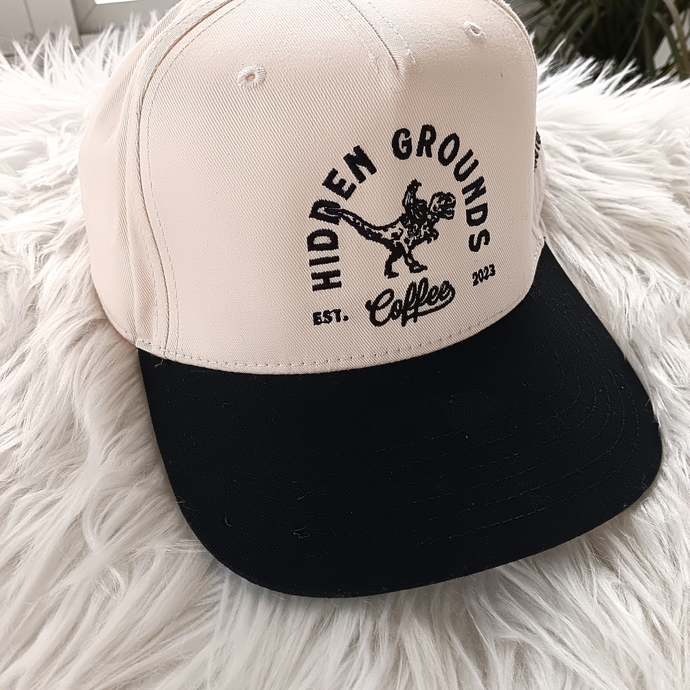 Otto Hidden Threads Cream & Black Dino Cowboy Coffee Graphic Trucker Hat
